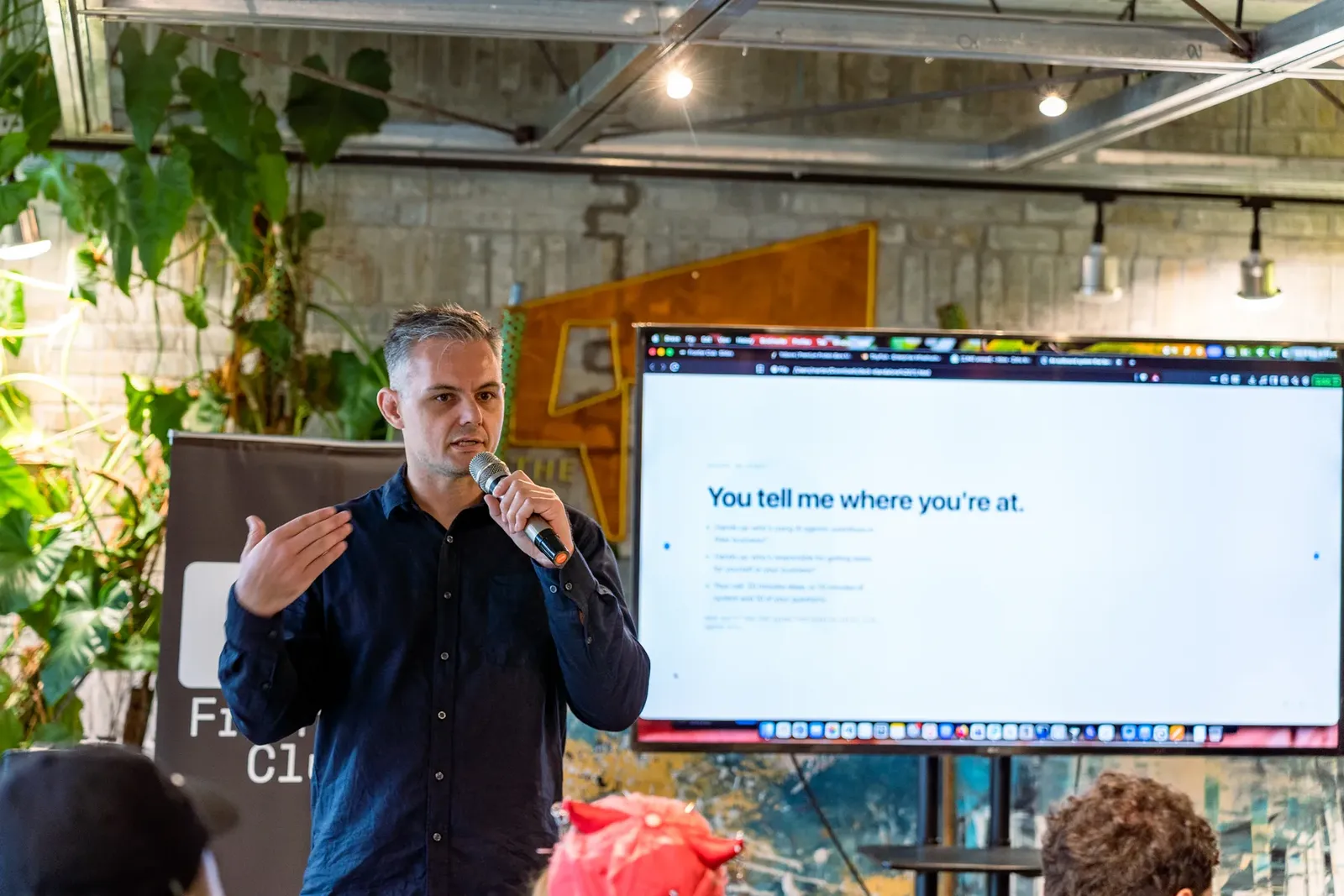 Presenting at an AI learning event, with a slide that reads: You tell me where you're at